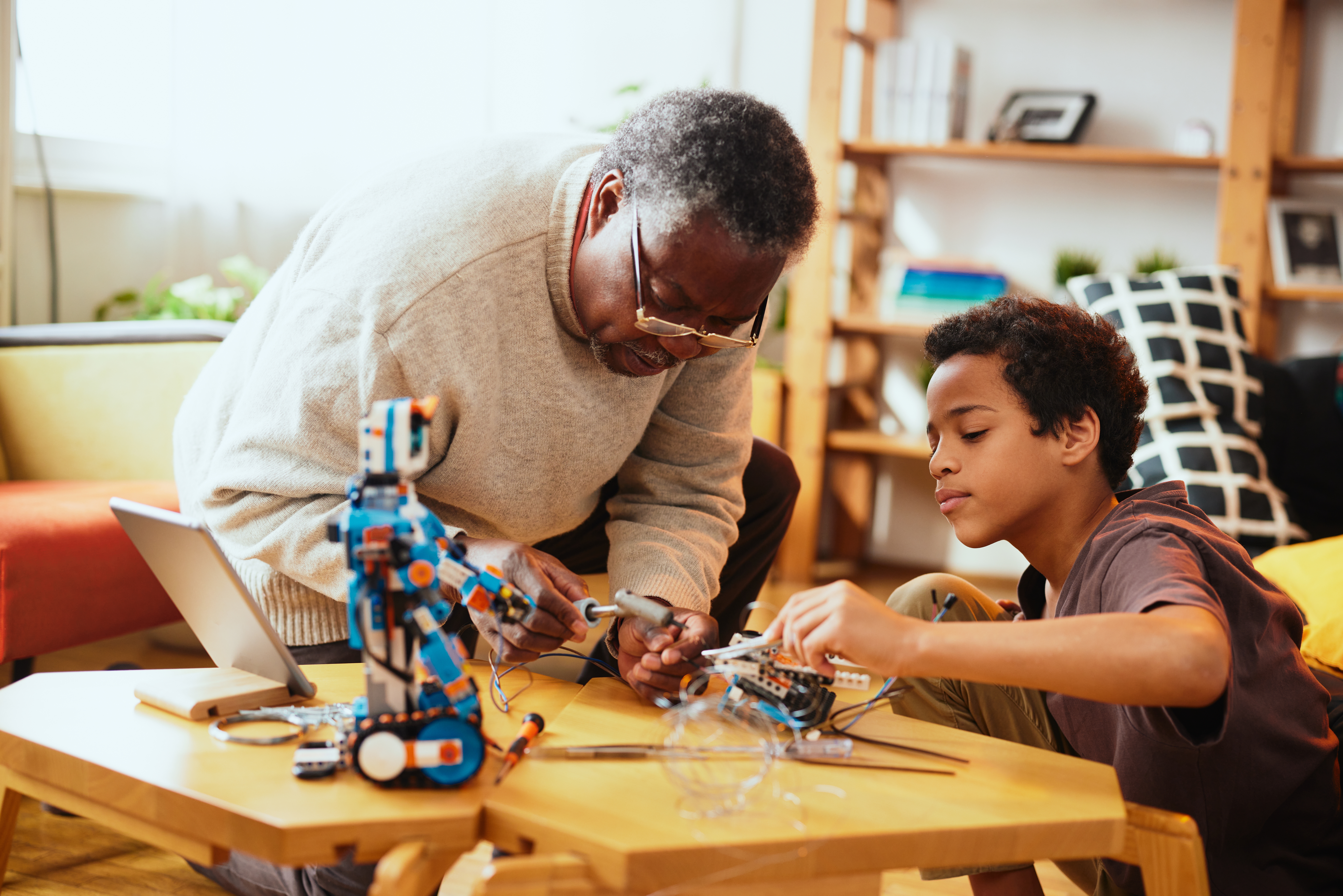 A,Grandfather,Showing,His,Grandchild,How,To,Make,A,Robot